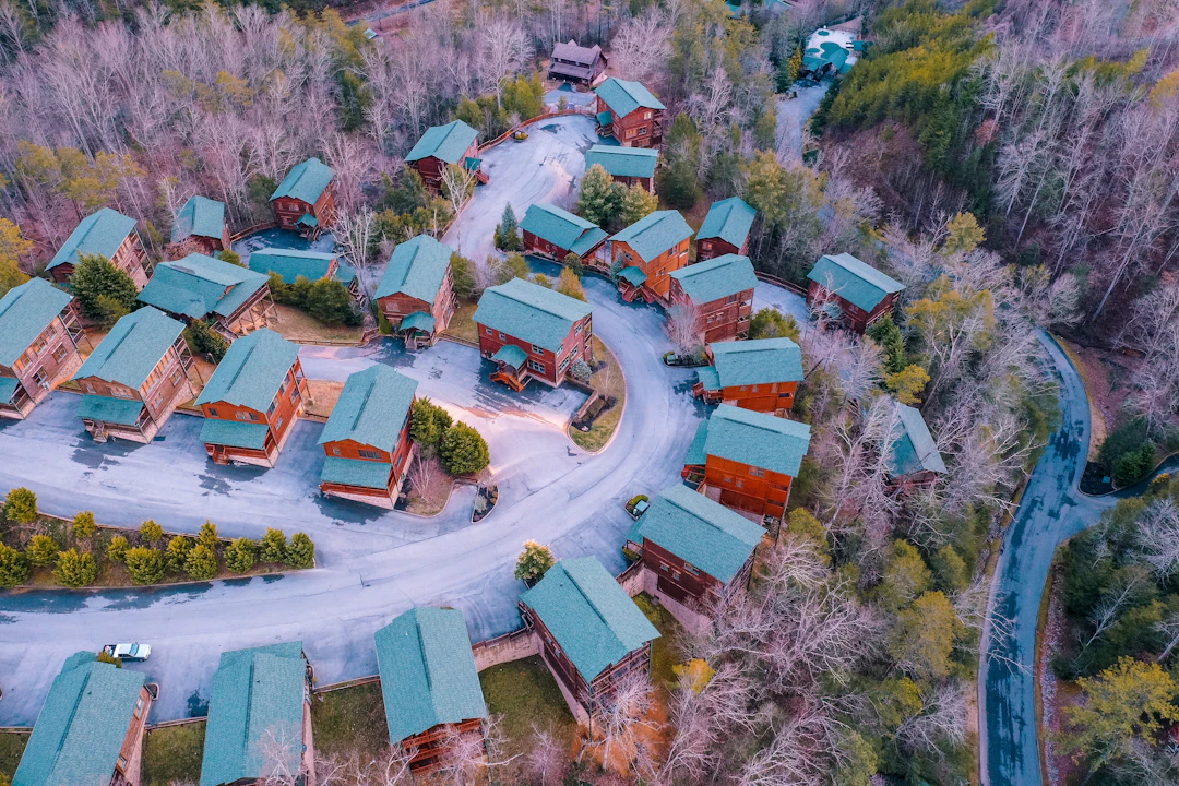 Buildings and roads surrounded by wooded mountain slopes